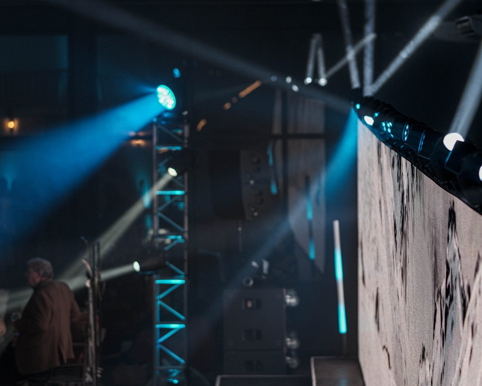 Beams fanning across the speaker stack at a party